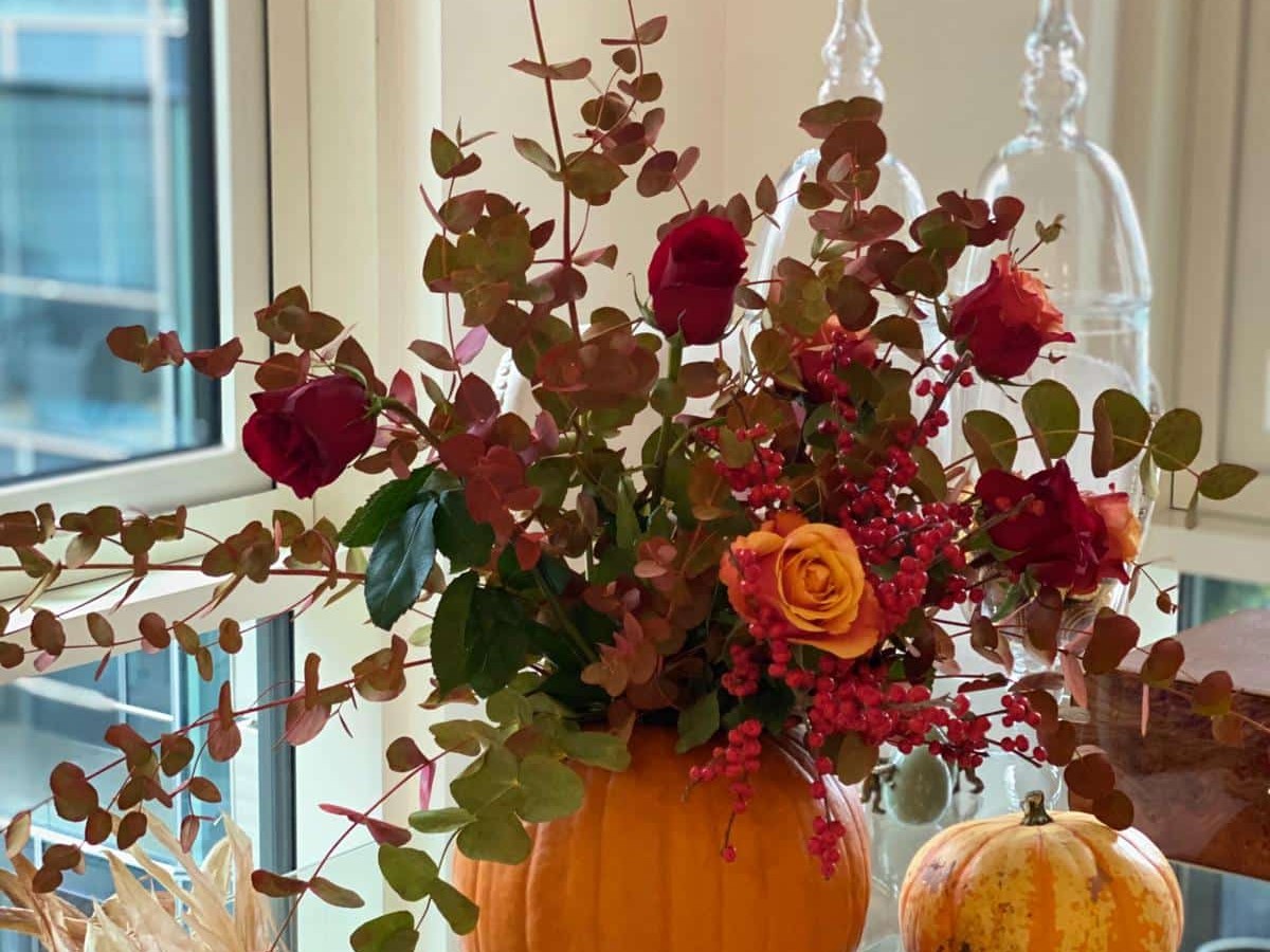 pumpkin vase full of flowers
