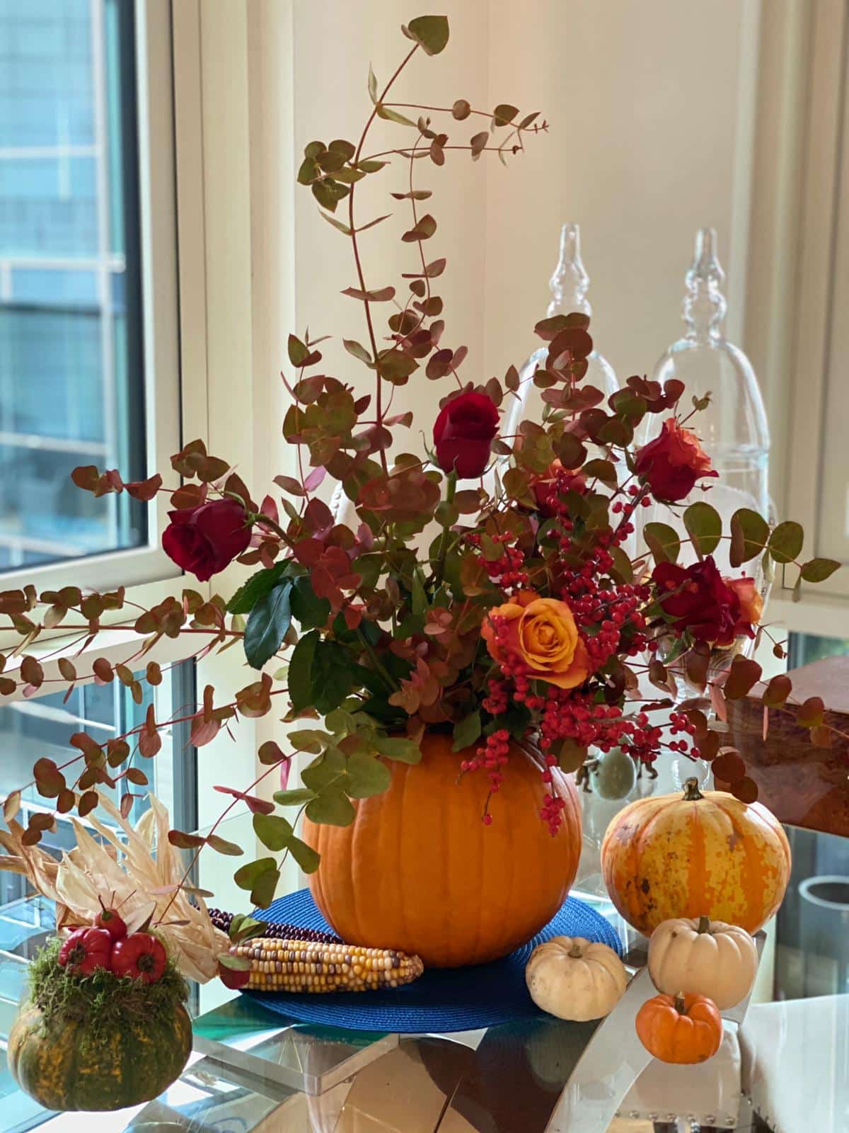pumpkin vase full of flowers