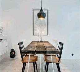 tom dixon pendant light above dining table