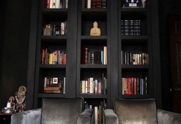 deep rich charcoal painted bookshelves
