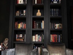 deep rich charcoal painted bookshelves