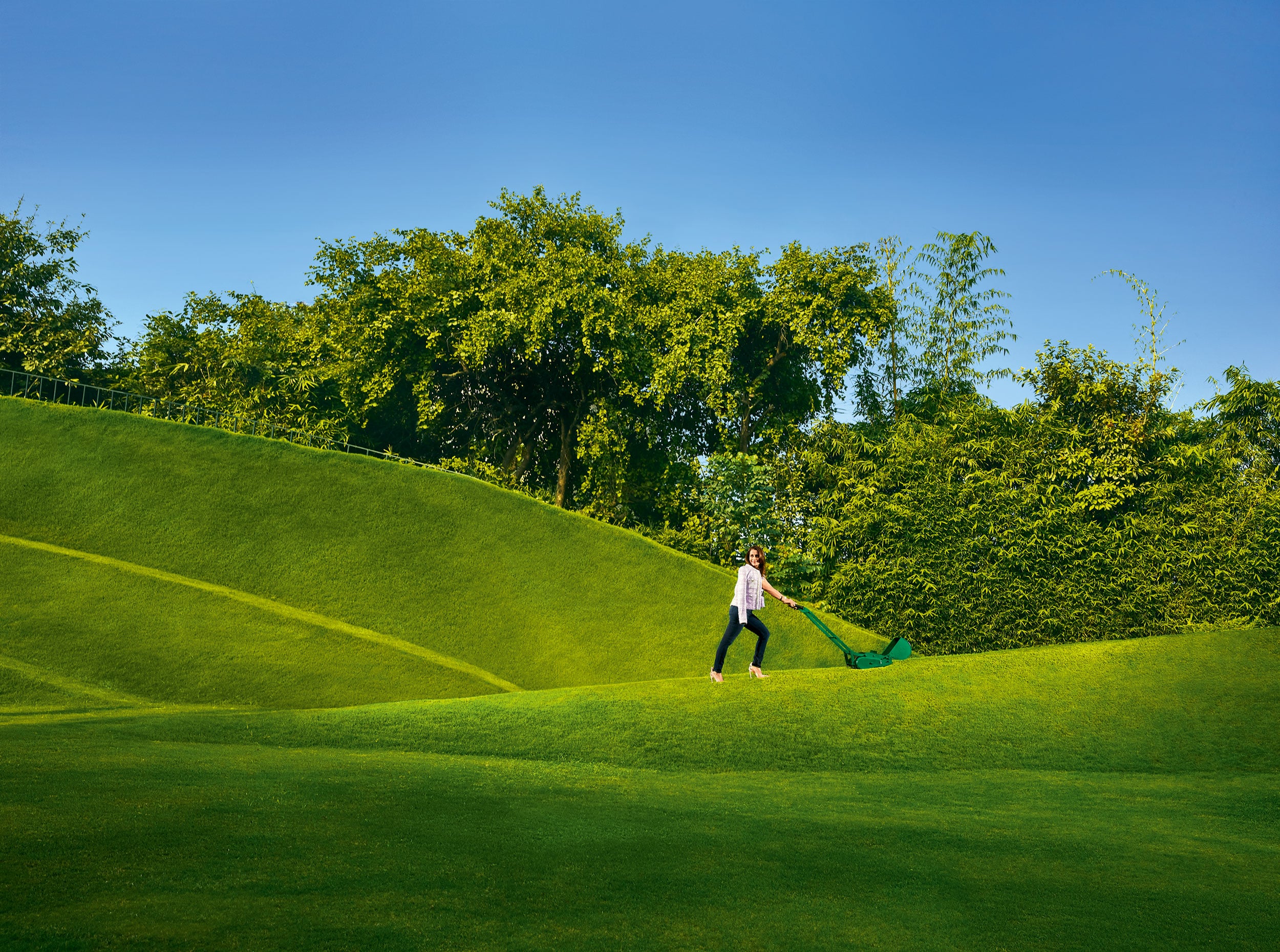 designer shalini misra on the grounds of her farmhouse, landscaped by charles jencks