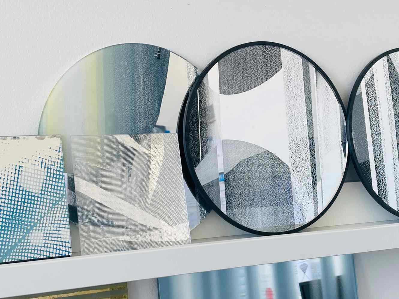 round mirrors on shelf